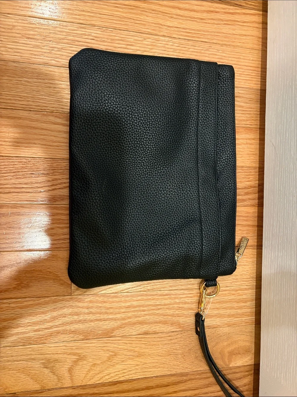 Itzy Ritzy Black Pebbled Changing Clutch with Gold Accent
